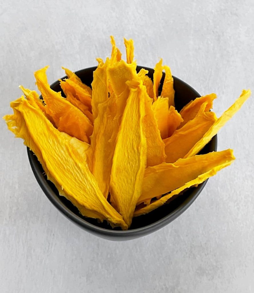 dried mango slices in a bowl
